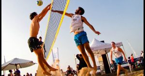 Guys Playing Sand Volleyball